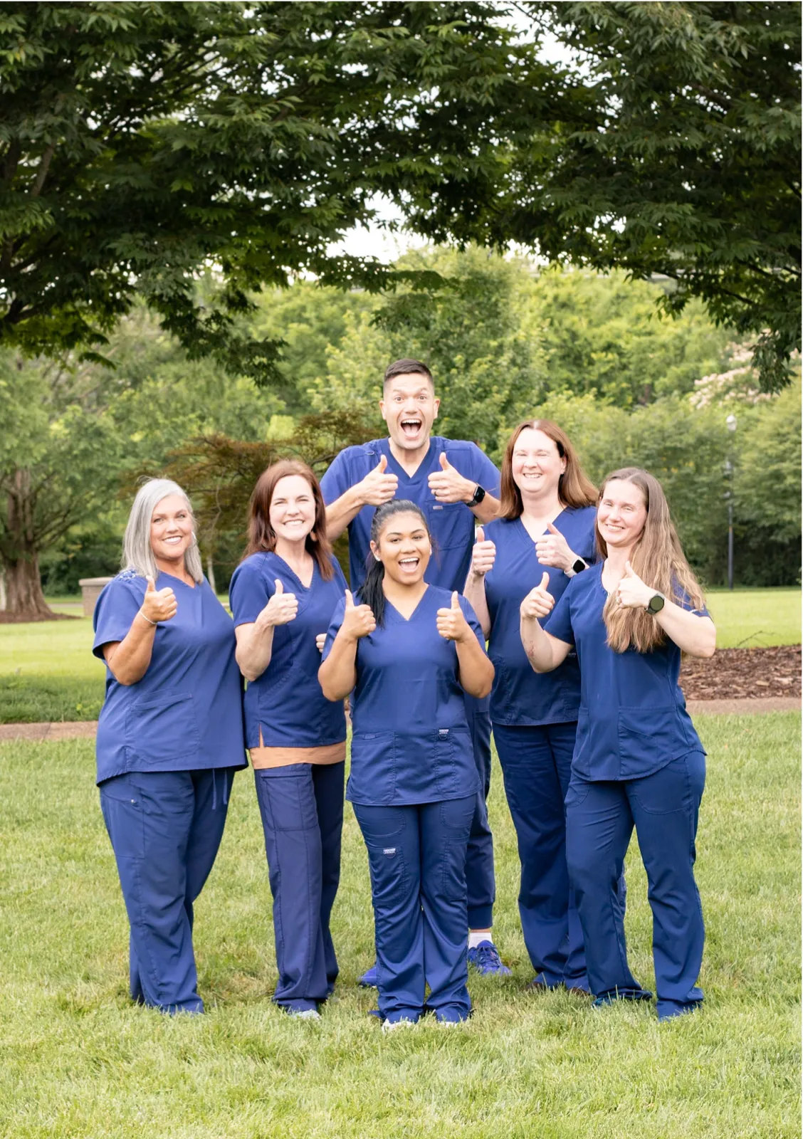 The Magnolia Implants & General Dentistry team giving a thumbs up