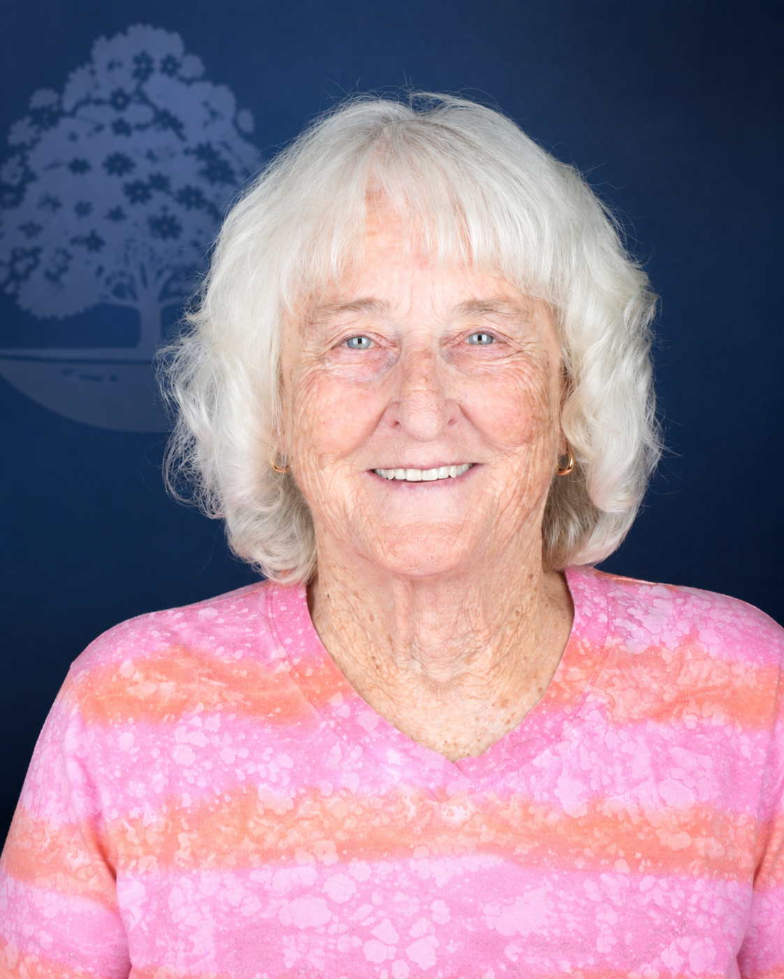 Smiling patient with white hair, portrait after dental implant treatment