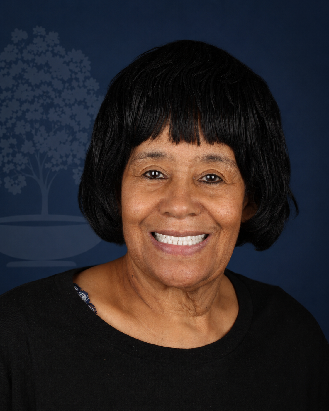 Smiling patient with short black hair, portrait after dental implant treatment
