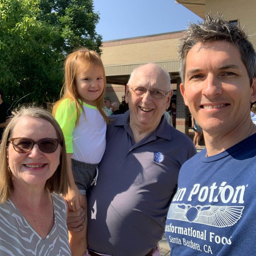 Chris with his father, mother and daughter
