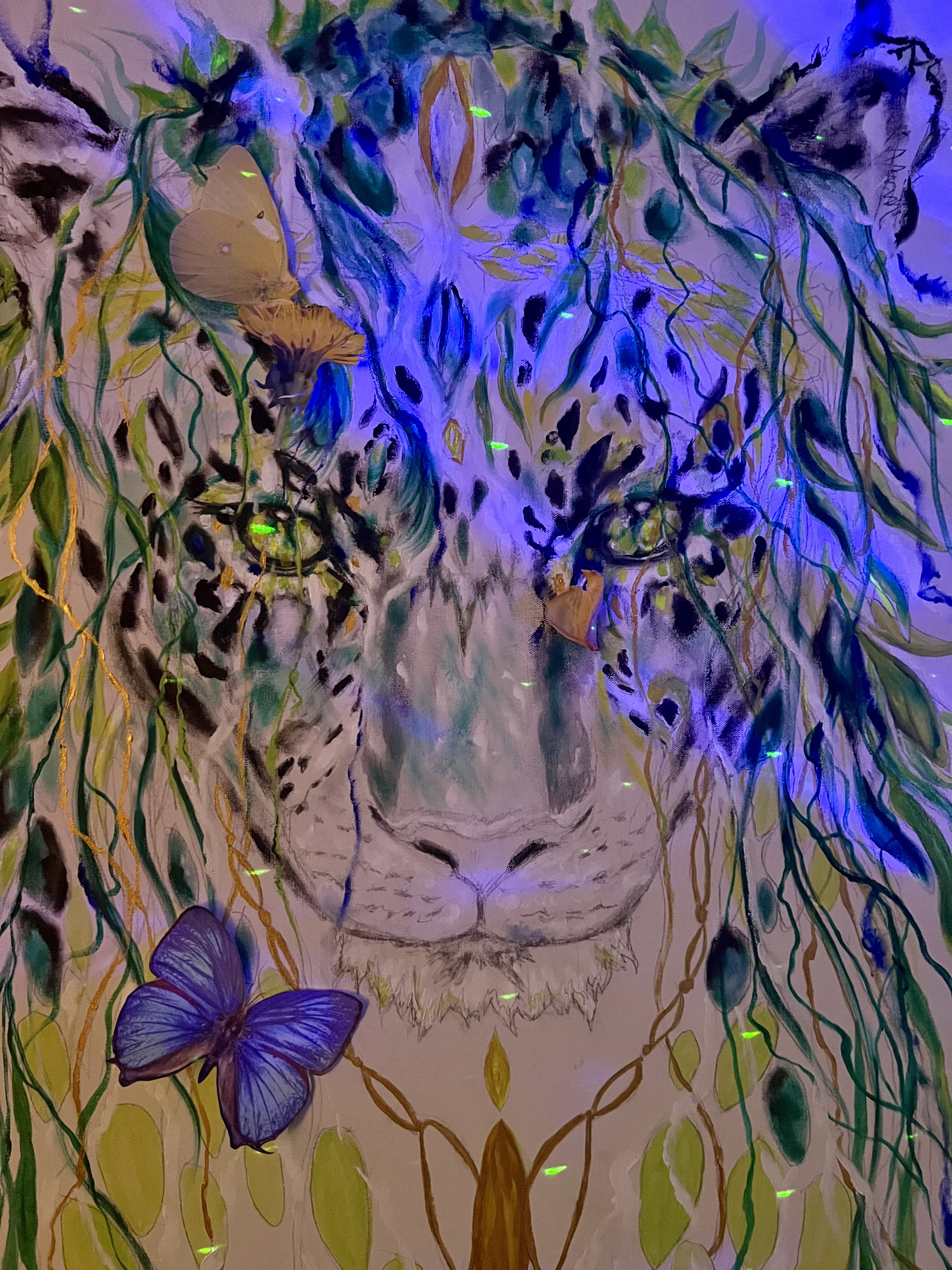 Leopard glowing violet and blue under ultraviolet light