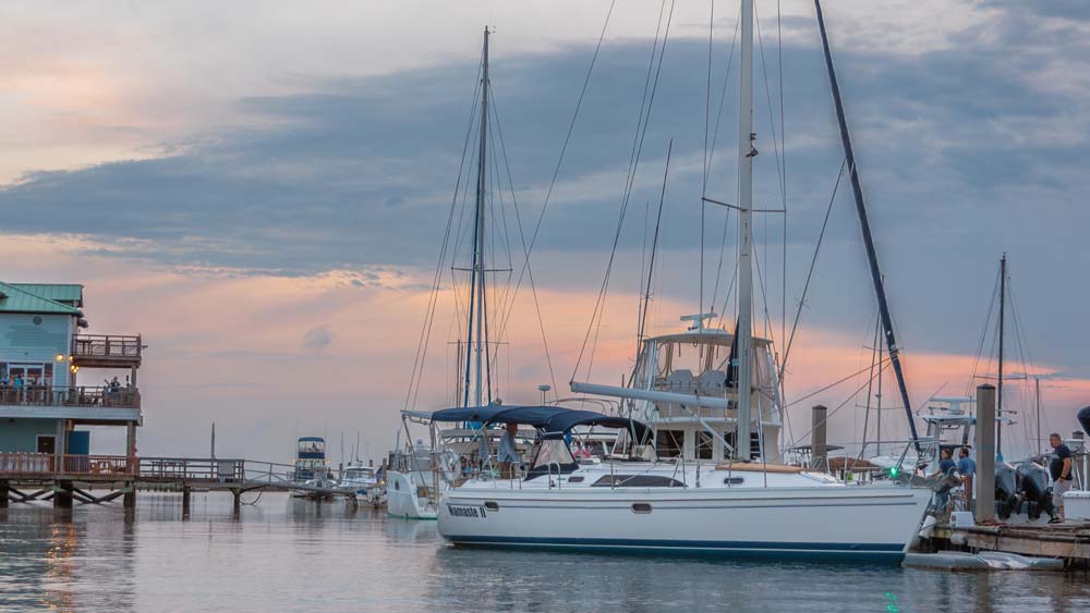 Sailboats docked near Folly Beach and Charleston Harbor at sunset Sailboats docked near Folly Beach and Charleston Harbor at sunset