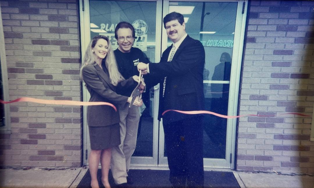 The ribbon cutting outside Planet Health