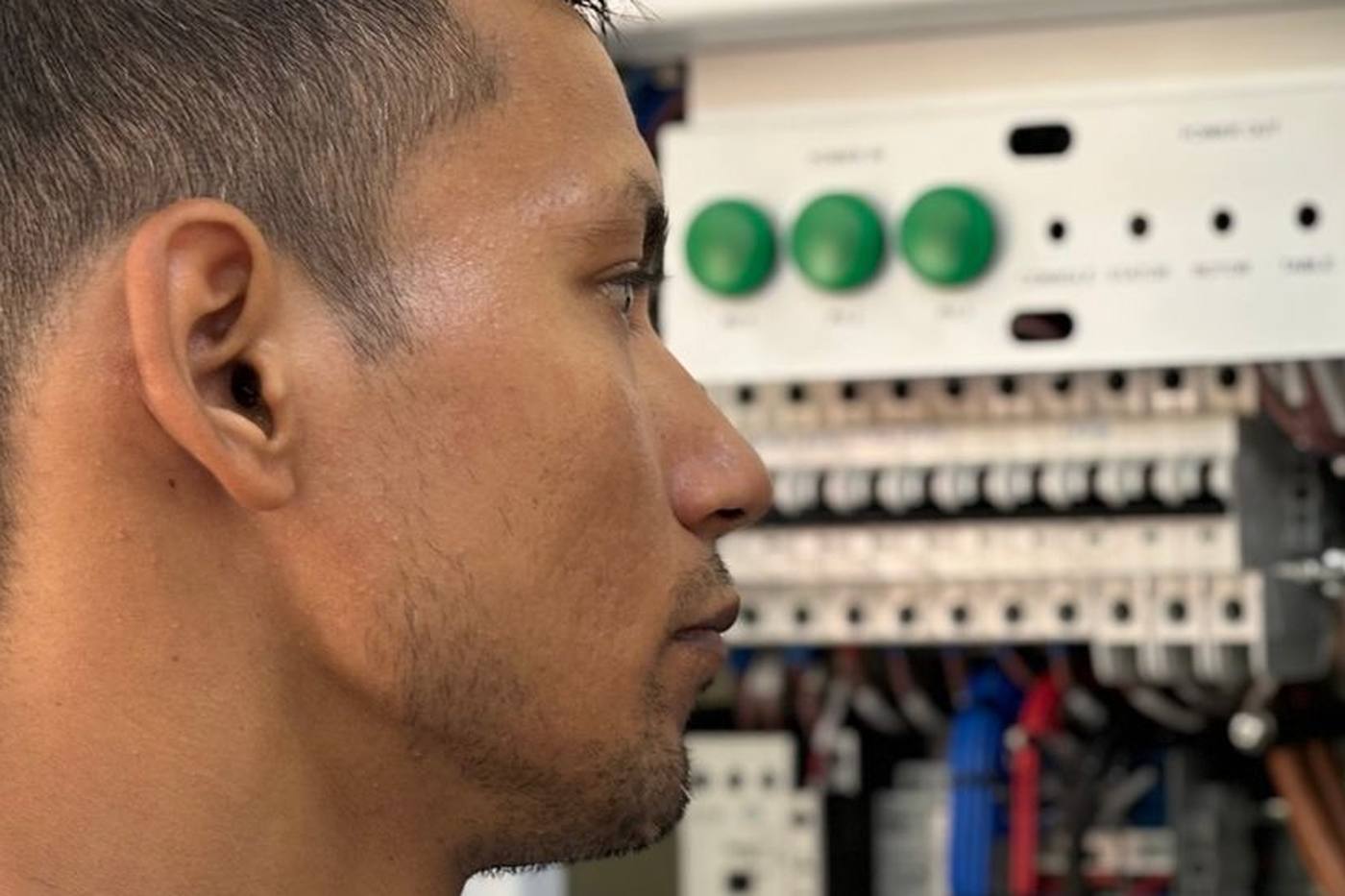 Electrician working in a breaker panel