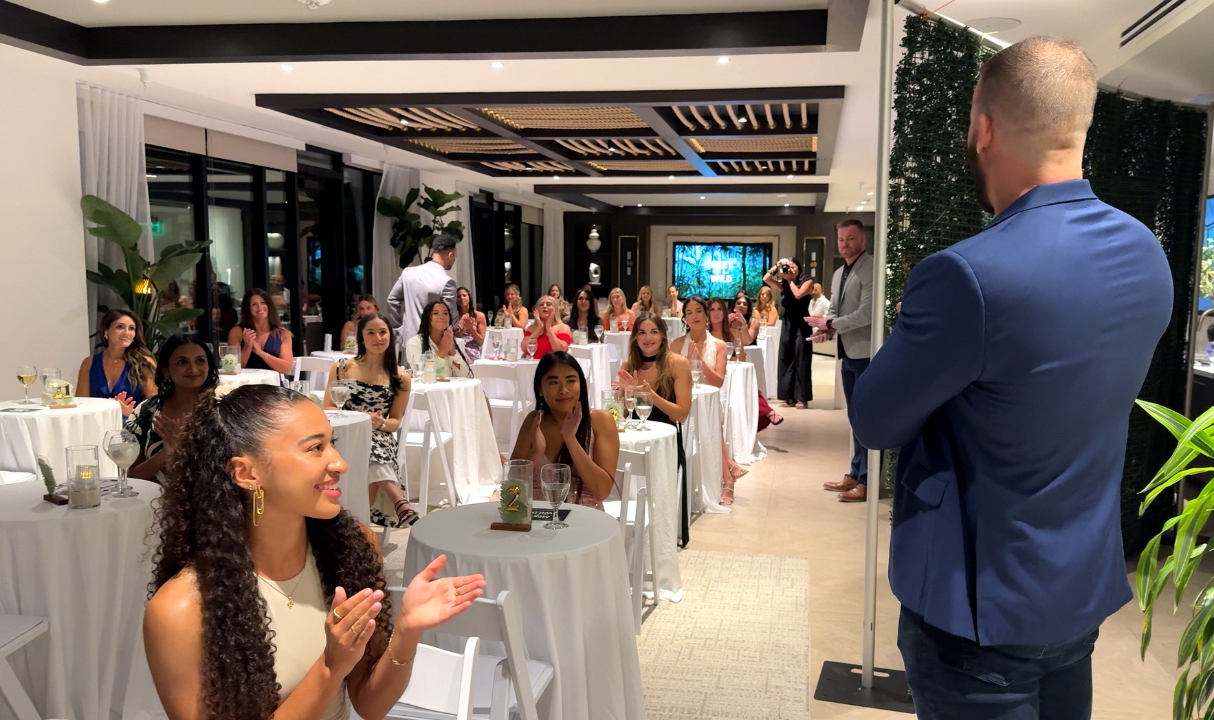 Kiley Lynch addressing a packed room of women at a Meet In The Wild event