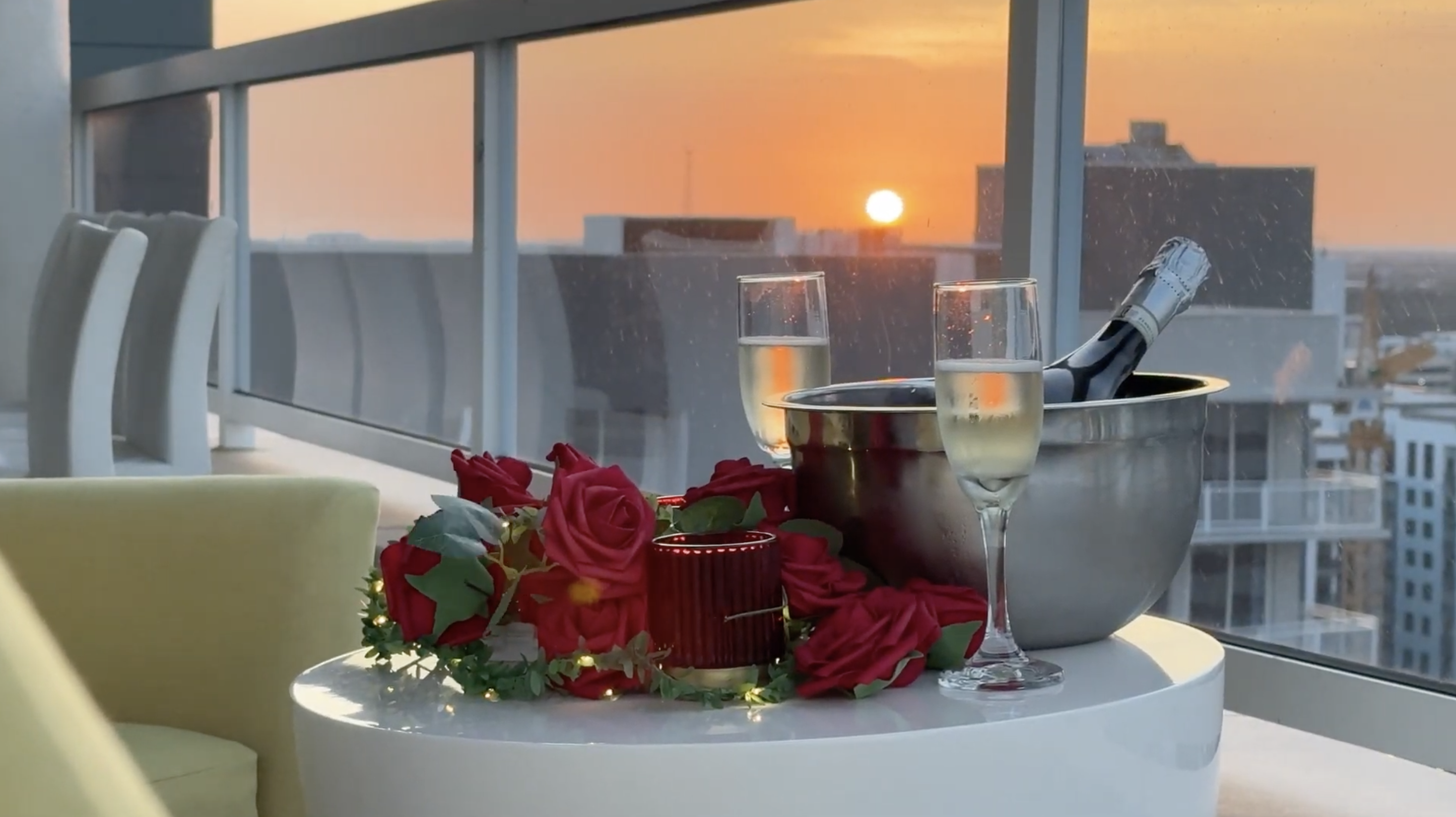 Rooftop sunset setup — champagne and city views before doors open
