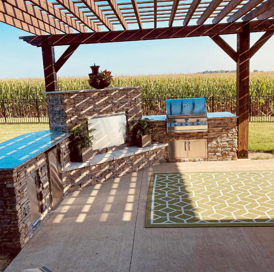 High-quality stone and masonry work anchoring a luxury outdoor grill area