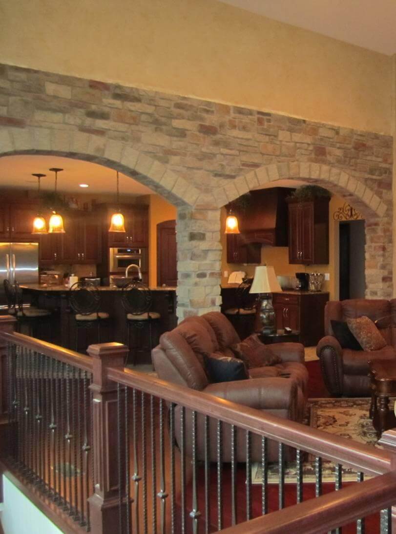A grand natural stone fireplace installation demonstrating authentic character and durability
