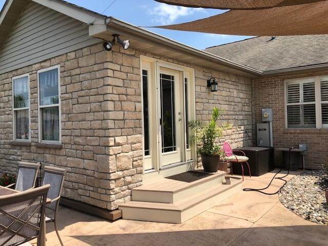 A beautifully crafted stone fireplace showcasing the texture and character of natural stone veneer