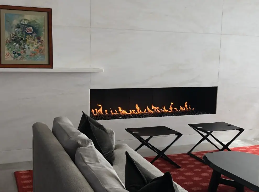 Interior of the Wiegmann Woodworking & Fireplaces showroom displaying custom fireplace installations