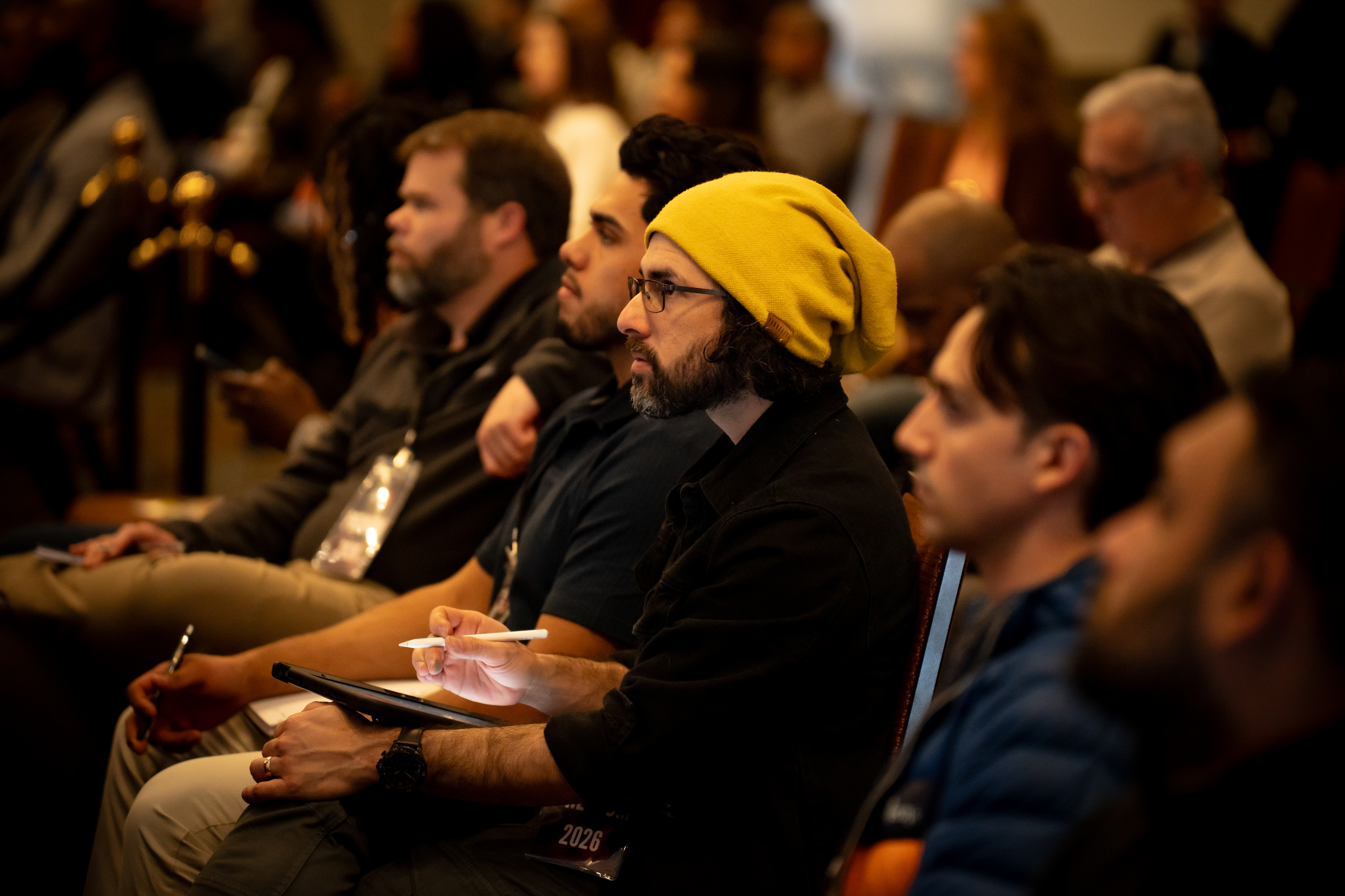 Attendees listening from the crowd