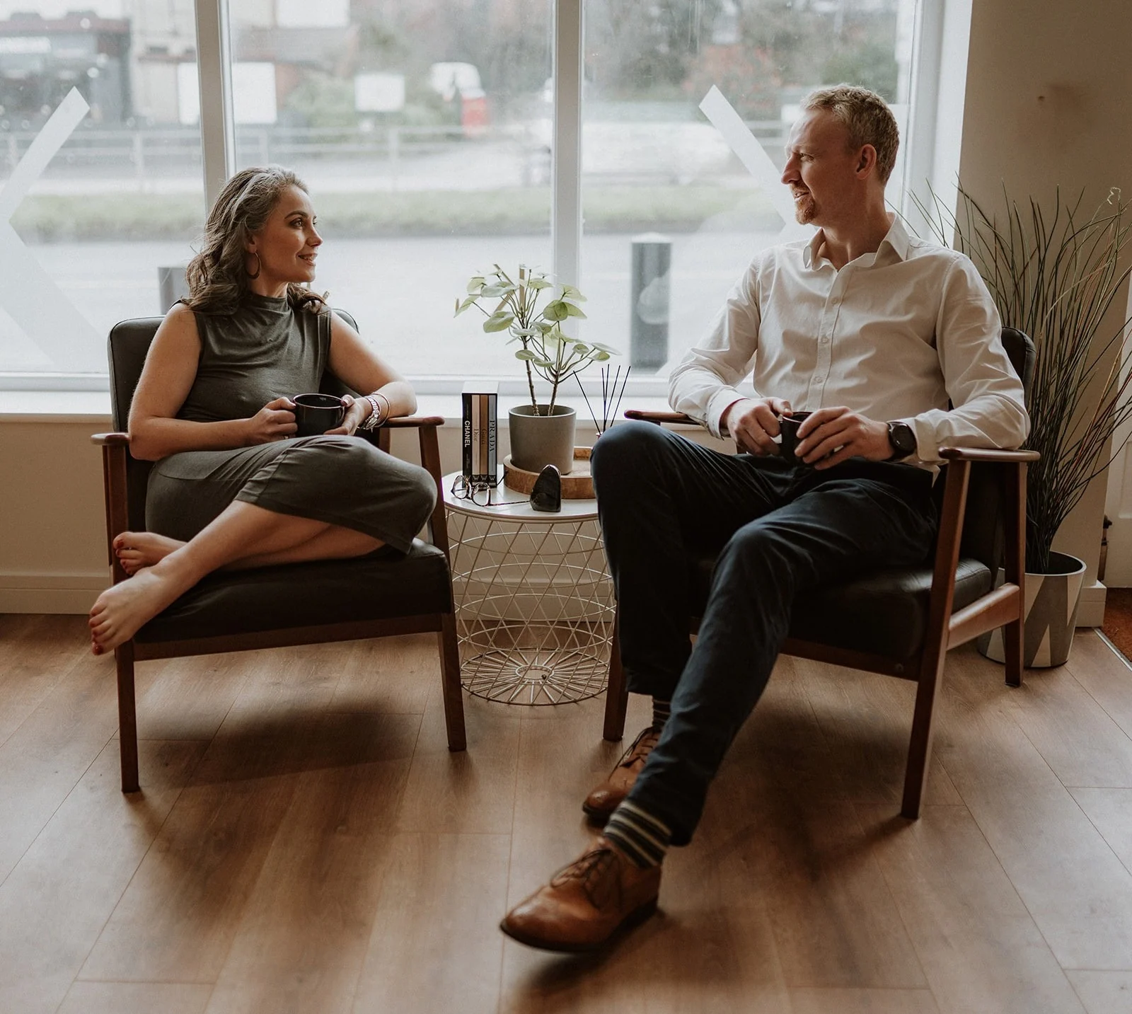 Mary and Morten, the chiropractors behind ClinOS, talking in their clinic