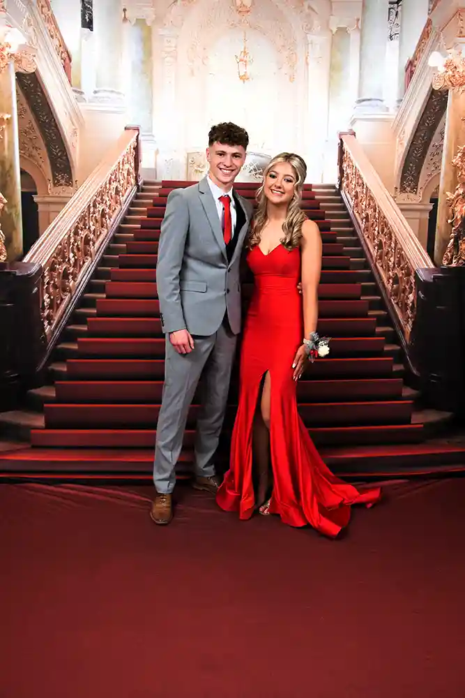 Debs Ball Couple posing at foot of stairs