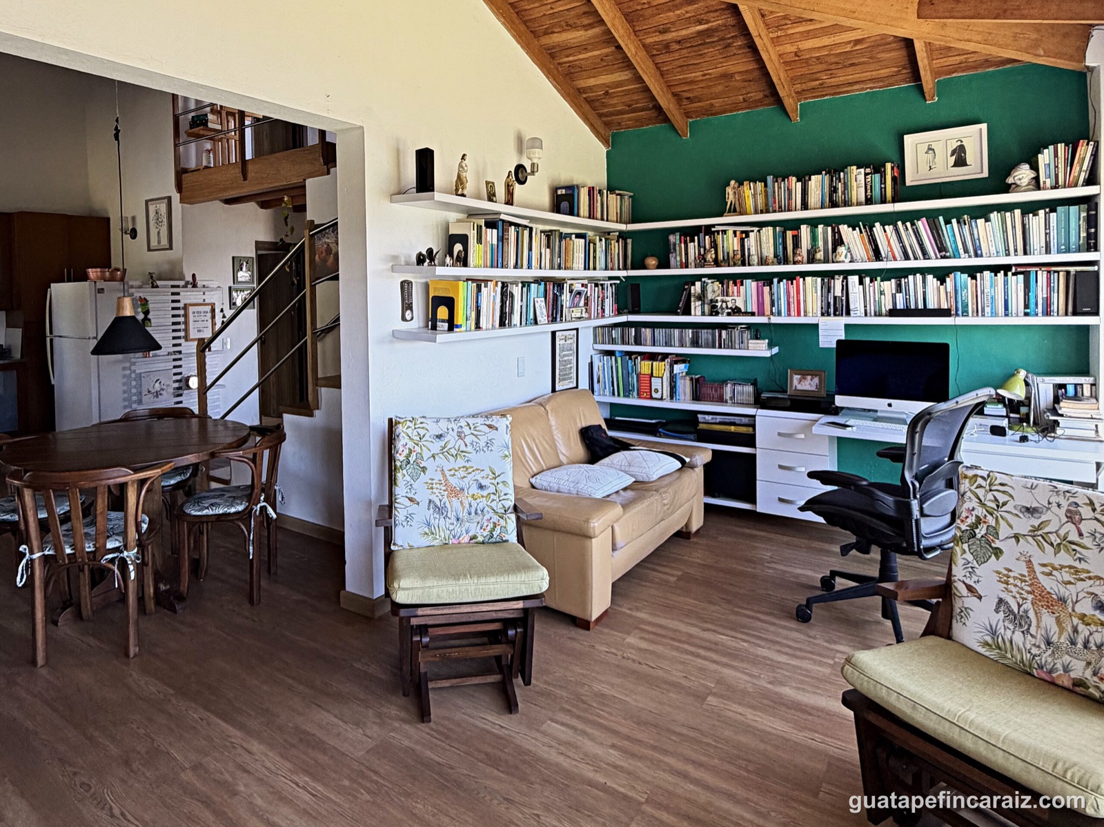 Living room and home office with built-in bookshelves