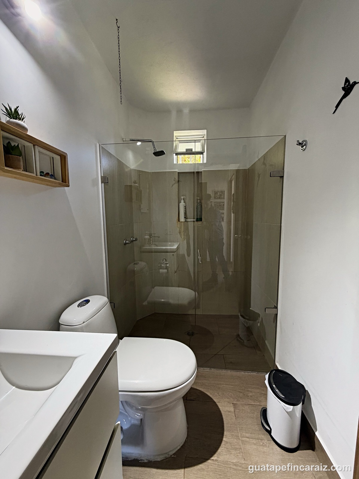 Bathroom with glass-enclosed shower