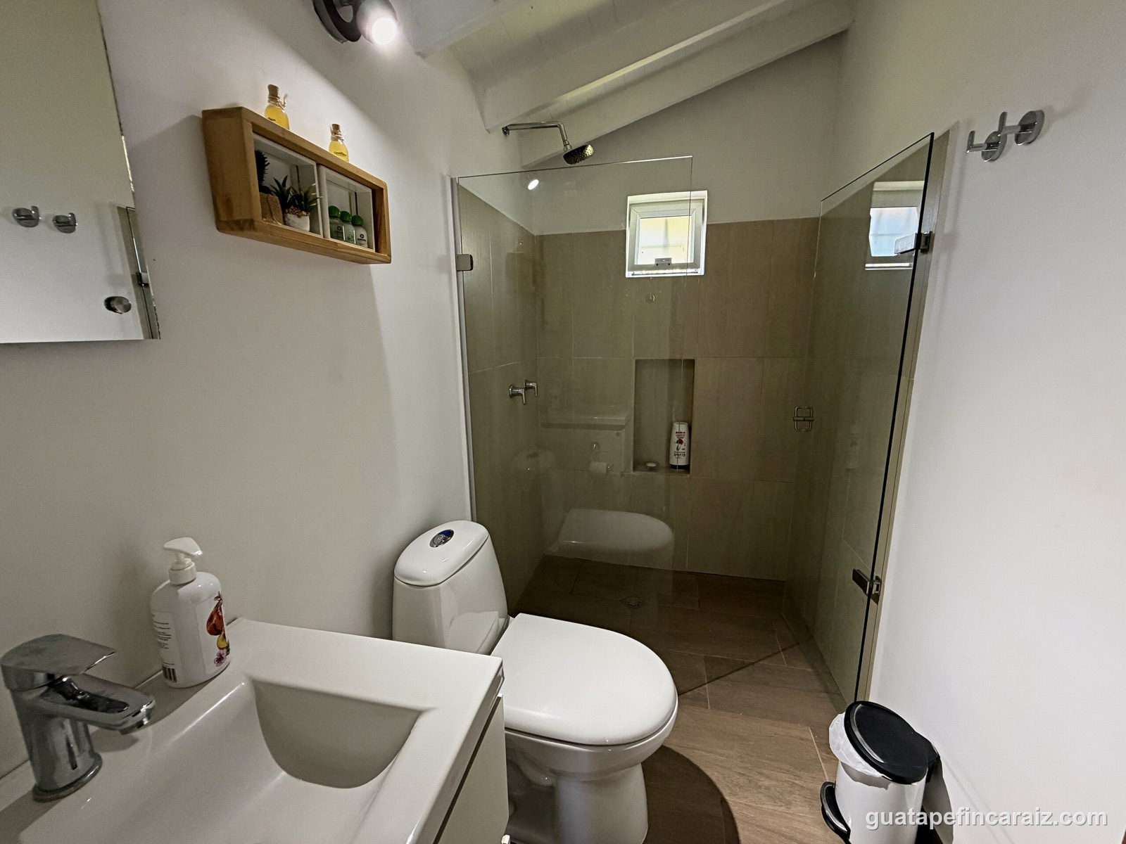 Second bathroom with glass-enclosed shower