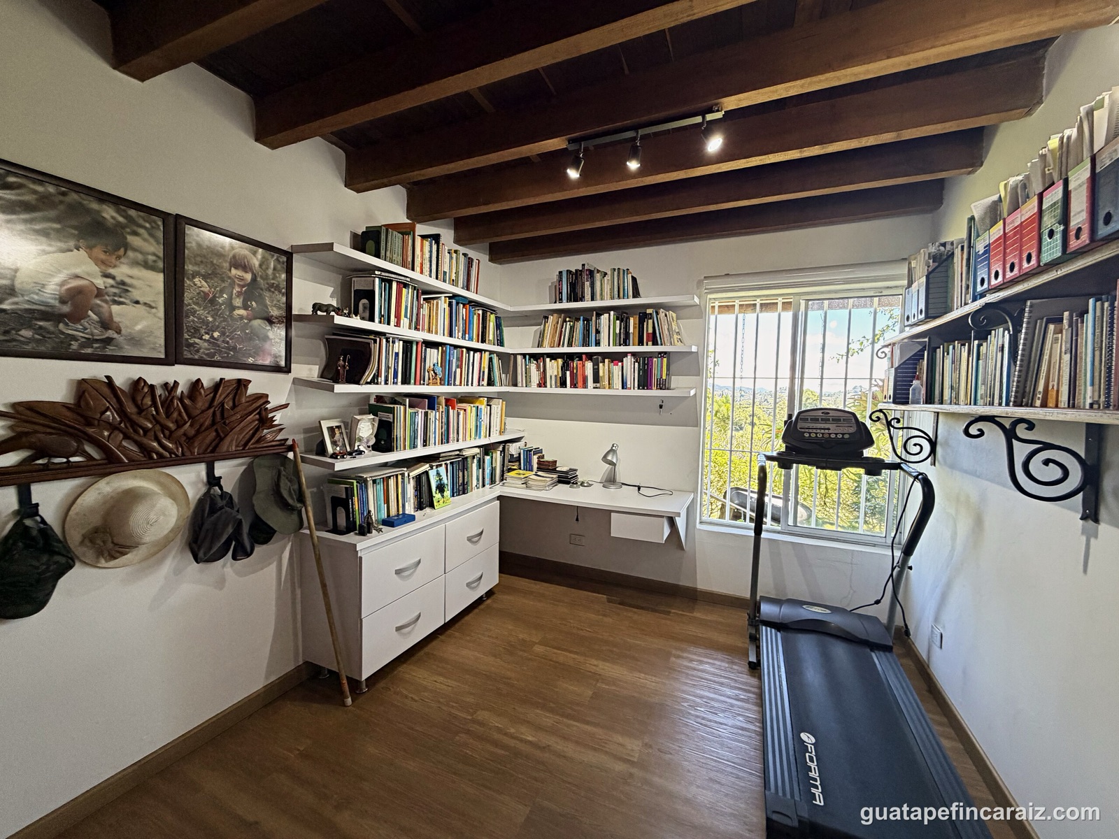 Home office and exercise nook with built-in shelving
