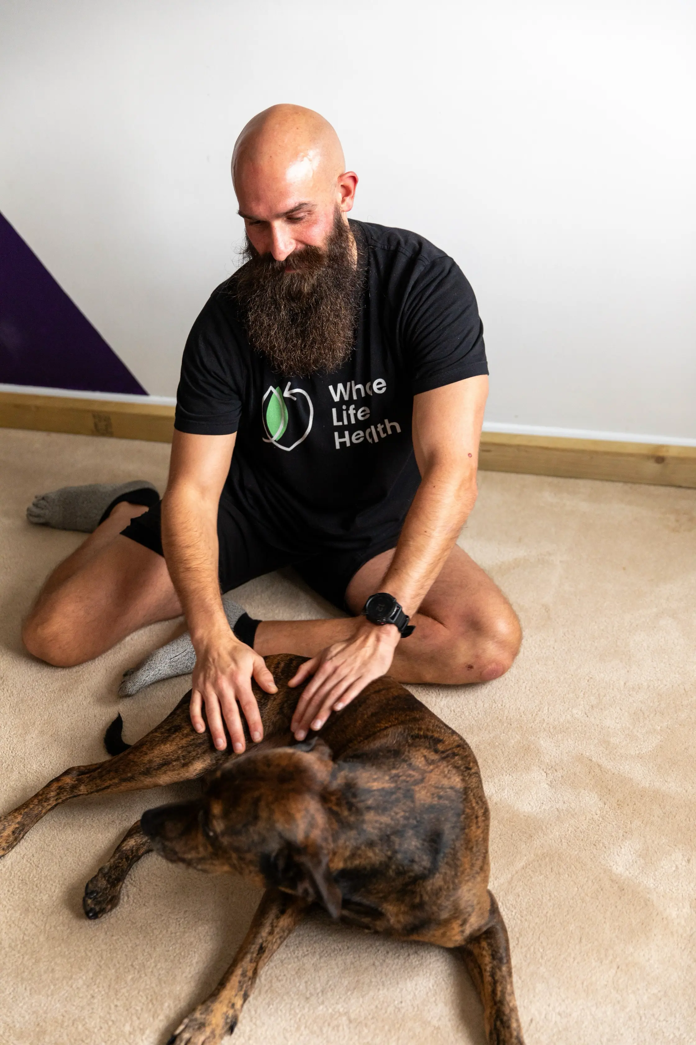 Health and Wellness Coach Jake Mahal with His Dog