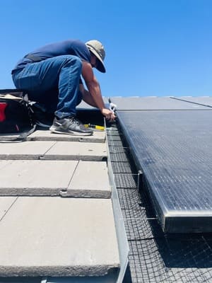Solar panel critter guard installation