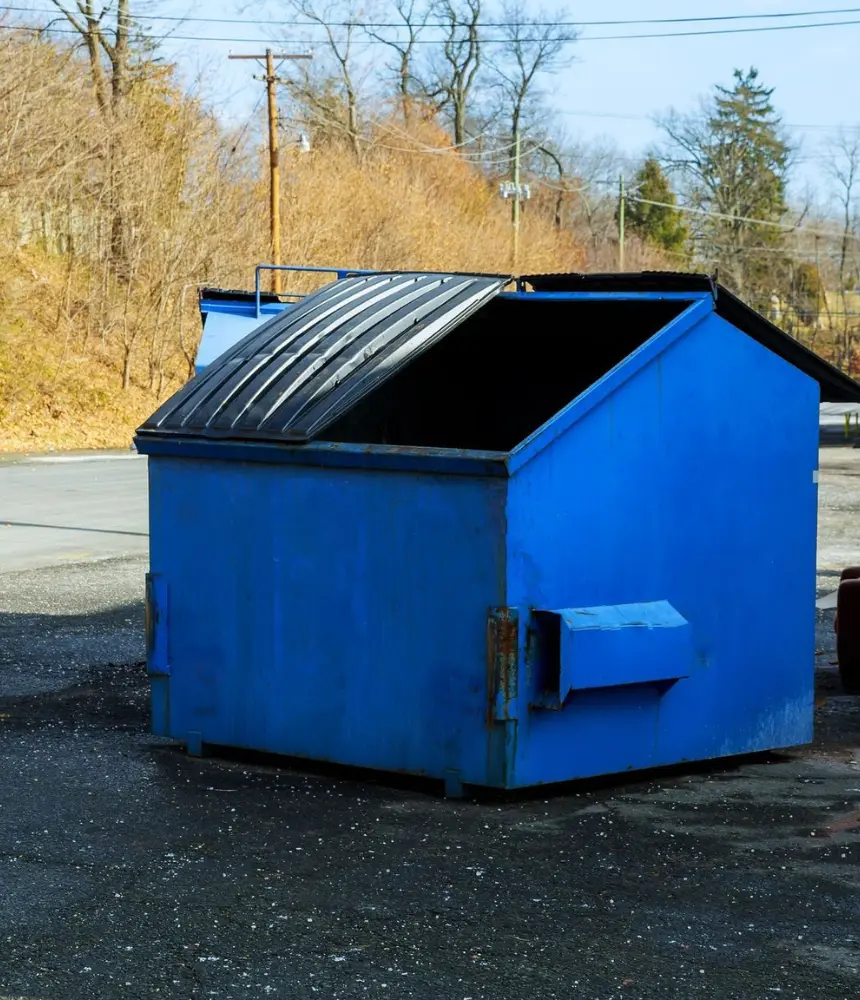 Dirty commercial blue dumpster before professional cleaning service