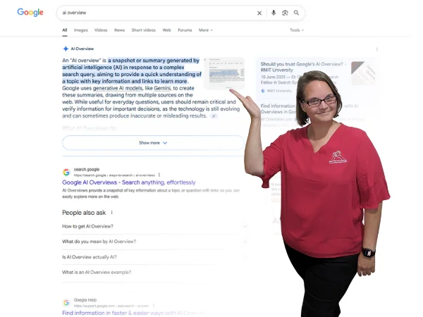 Photo of Ellie Clare owner of CLP Advertising pointing to an AI Overview