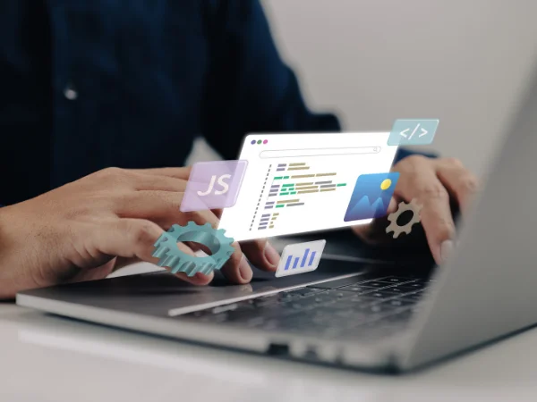 Hands typing on laptop with digital coding and data icons, illustrating content structure and clear formatting for AI visibility.