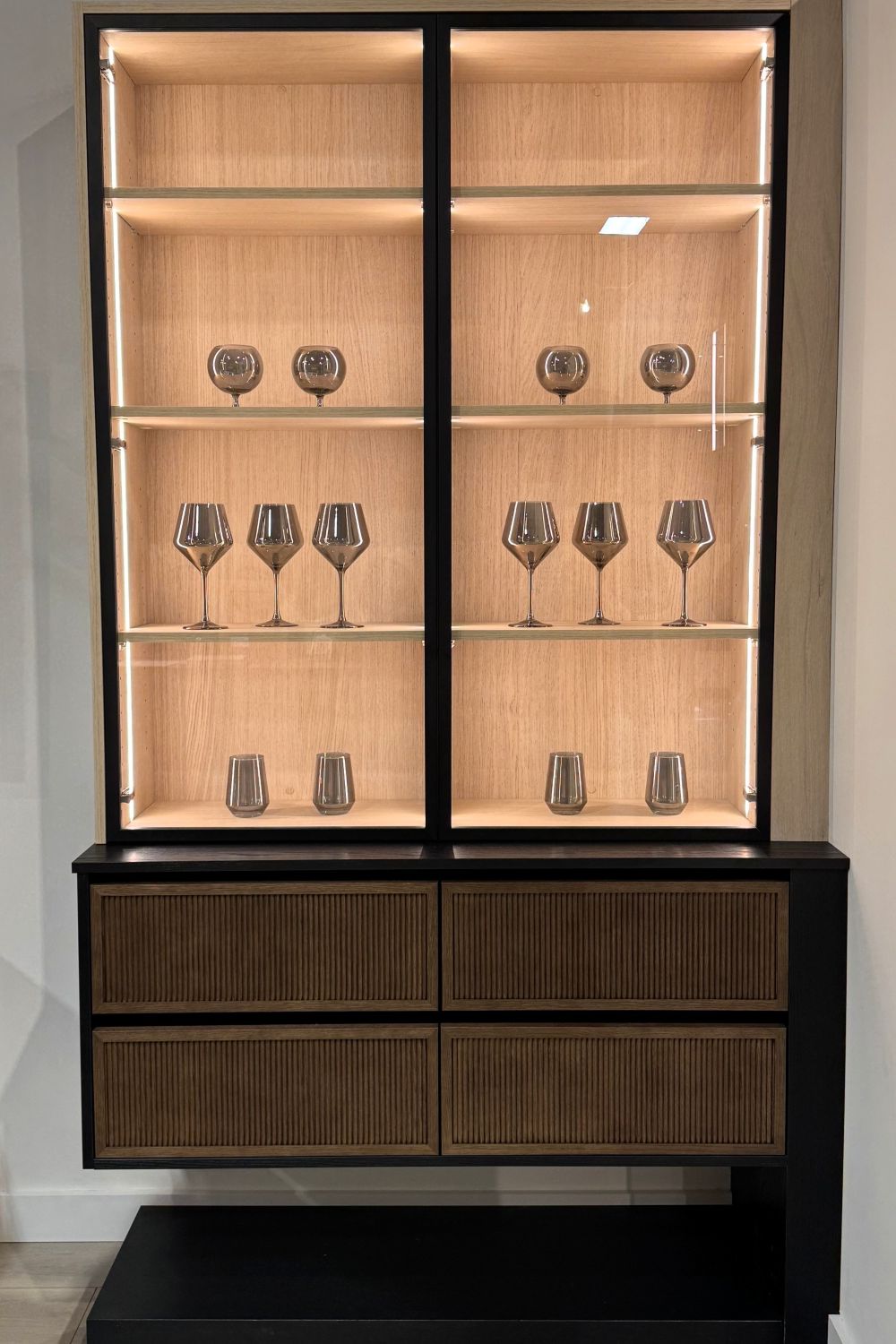 new custom built-in with metal doors, Shinnoki finish, fluted wood doors and Hafele Lighting new custom built-in with metal doors, Shinnoki finish, fluted wood doors and Hafele Lighting