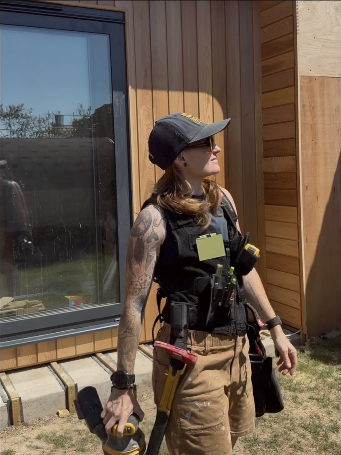 Yasmin Poole, founder and carpenter, on site in her work wear — YP Carpentry & Construction