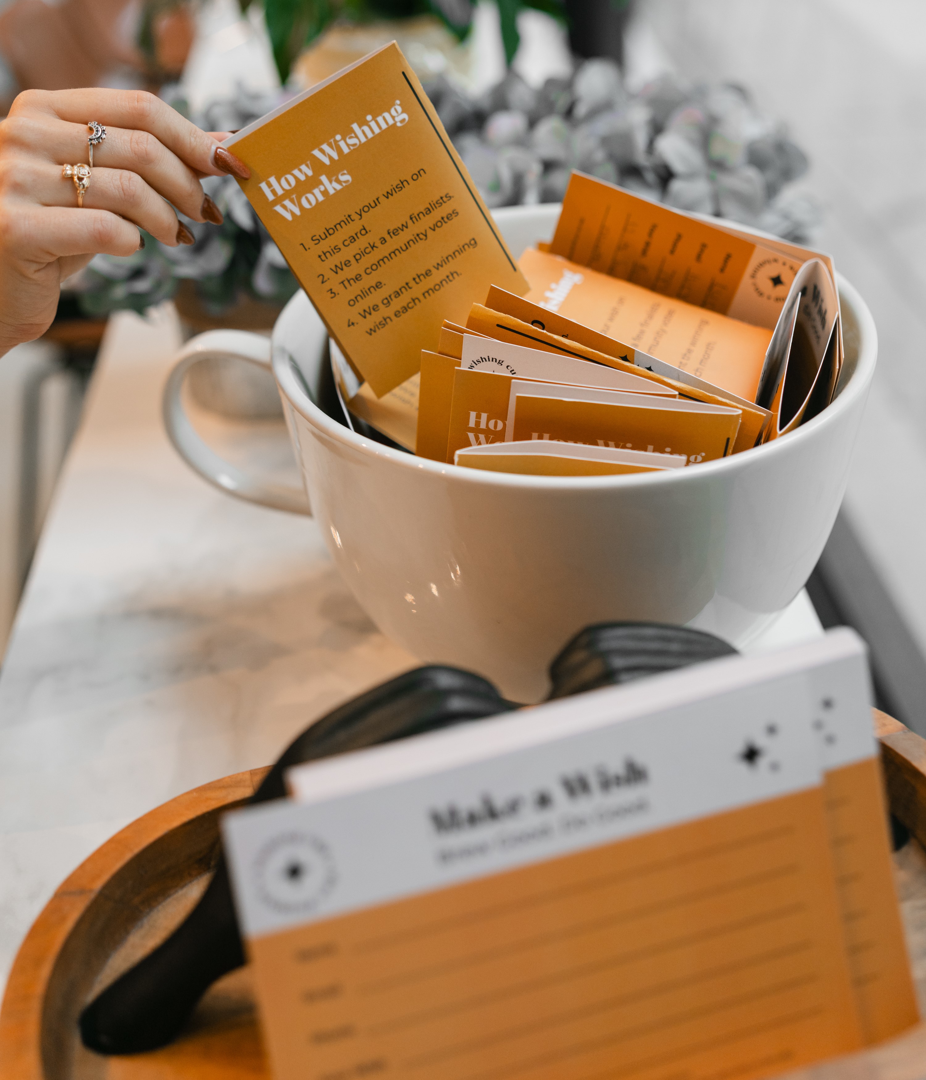 How Wishing Works hand selecting golden card