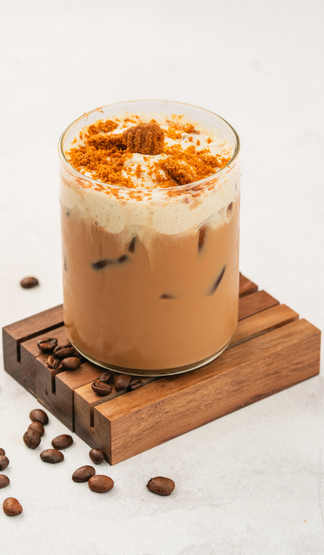 Iced latte topped with biscoff cookies