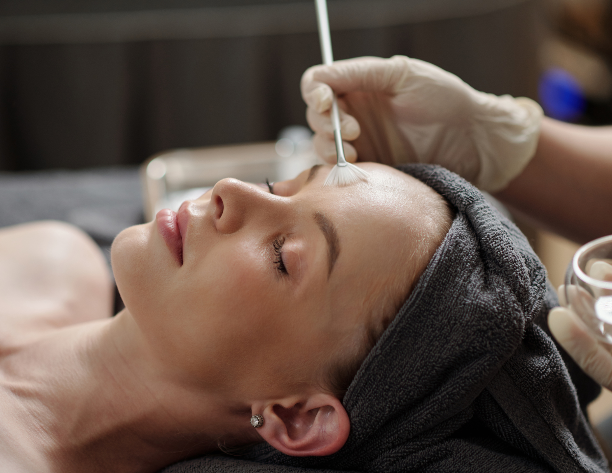 Chemical peel solution being professionally applied to a client's face