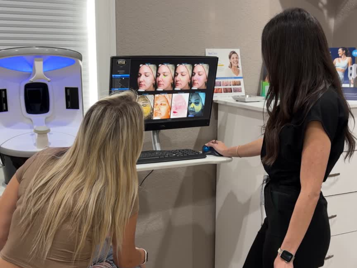 Dash Medical Spa provider reviewing skin analysis images with a client during a consultation