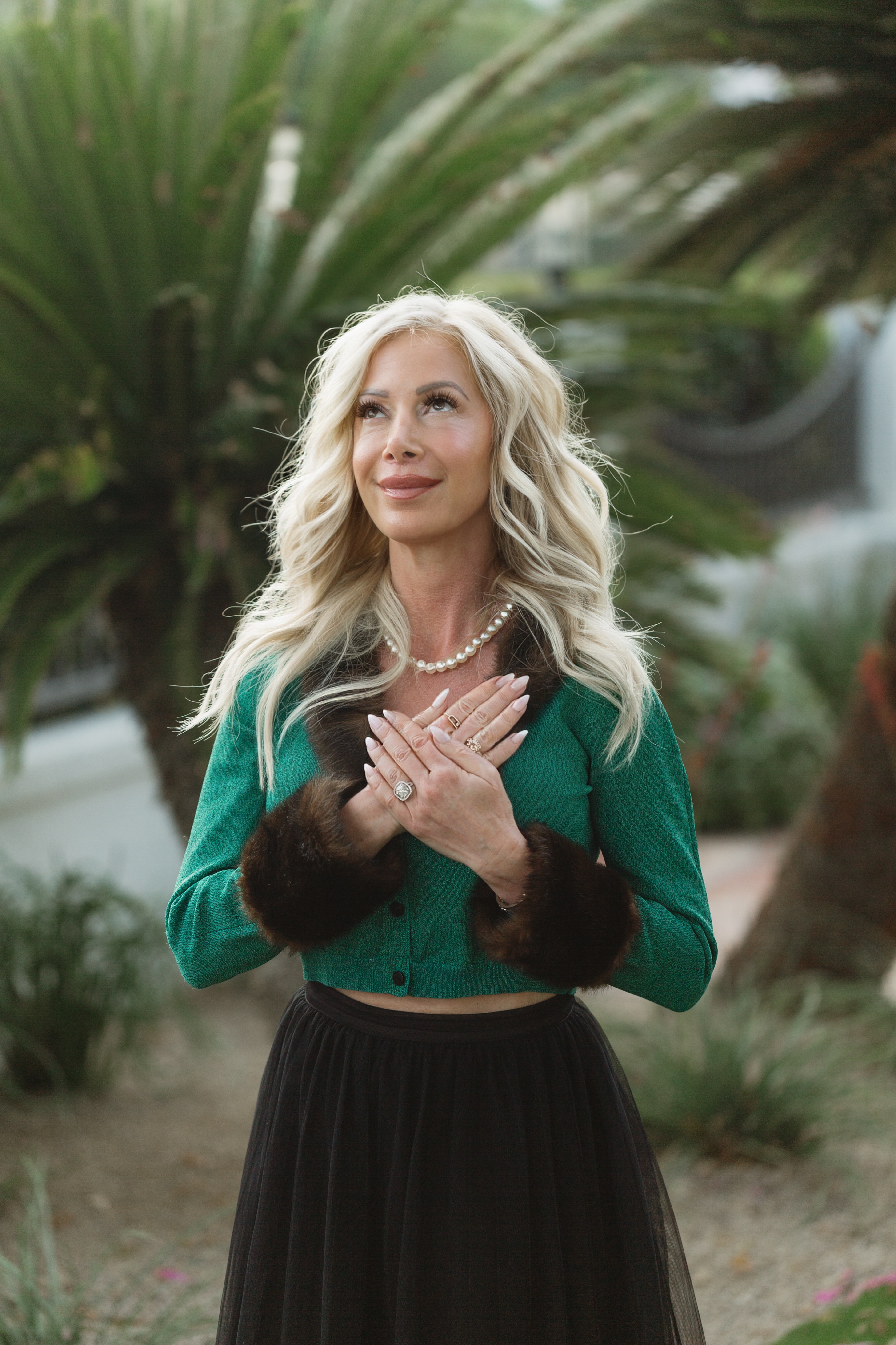 A thoughtful woman standing in a calm natural setting