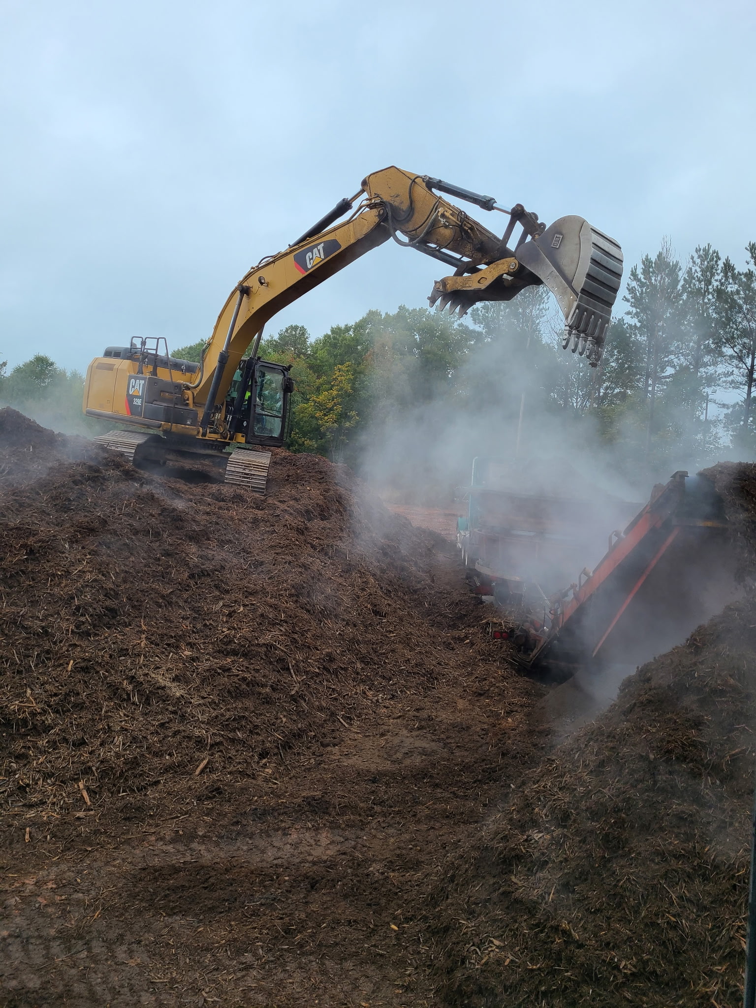 Excavator handling processed wood material