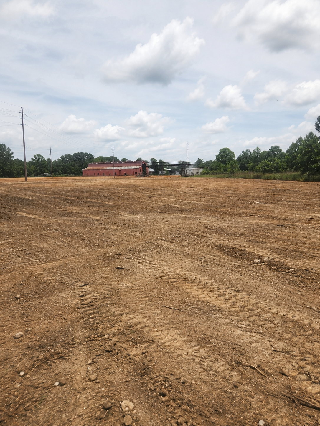 Bulldozer grading a cleared commercial property