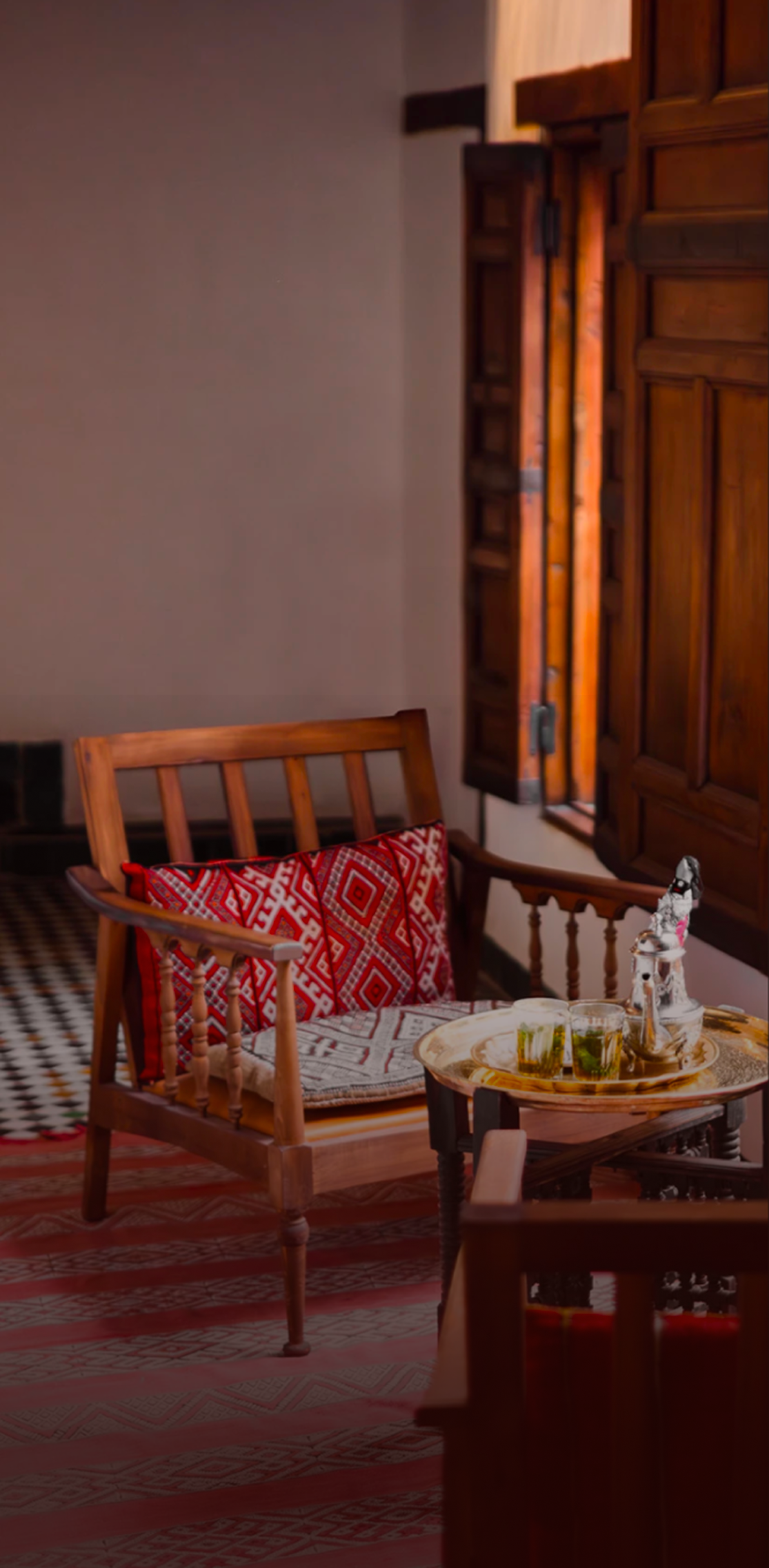 Moroccan lounge with red patterned cushions