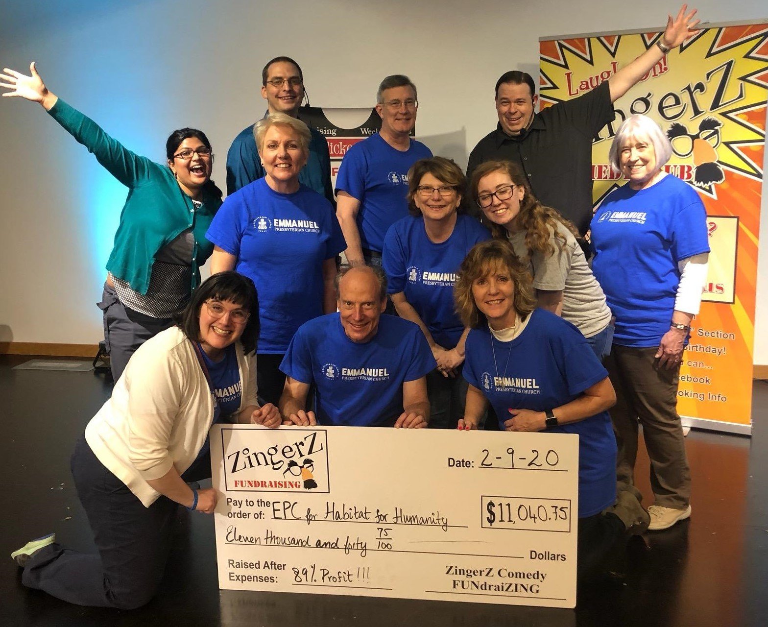 Emmanuel Presbyterian Church volunteers holding an $11,040 ZingerZ big check for Habitat for Humanity