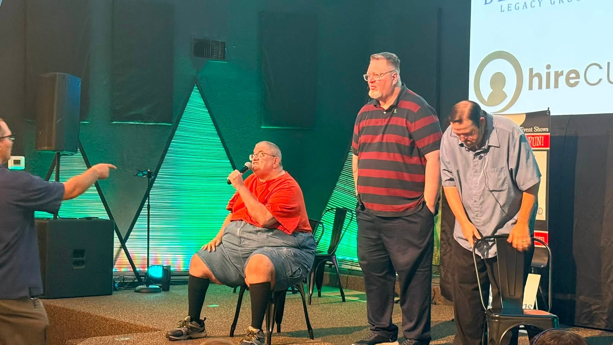 Volunteers on stage during an interactive improv bit