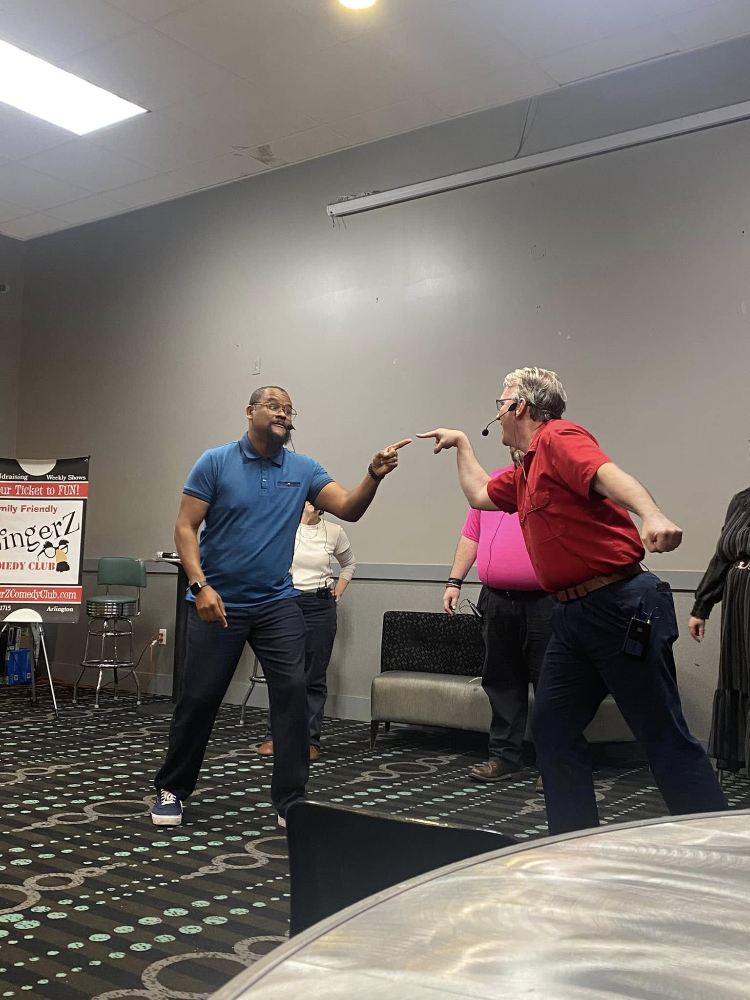 Two ZingerZ performers mid-scene during a clean improv set