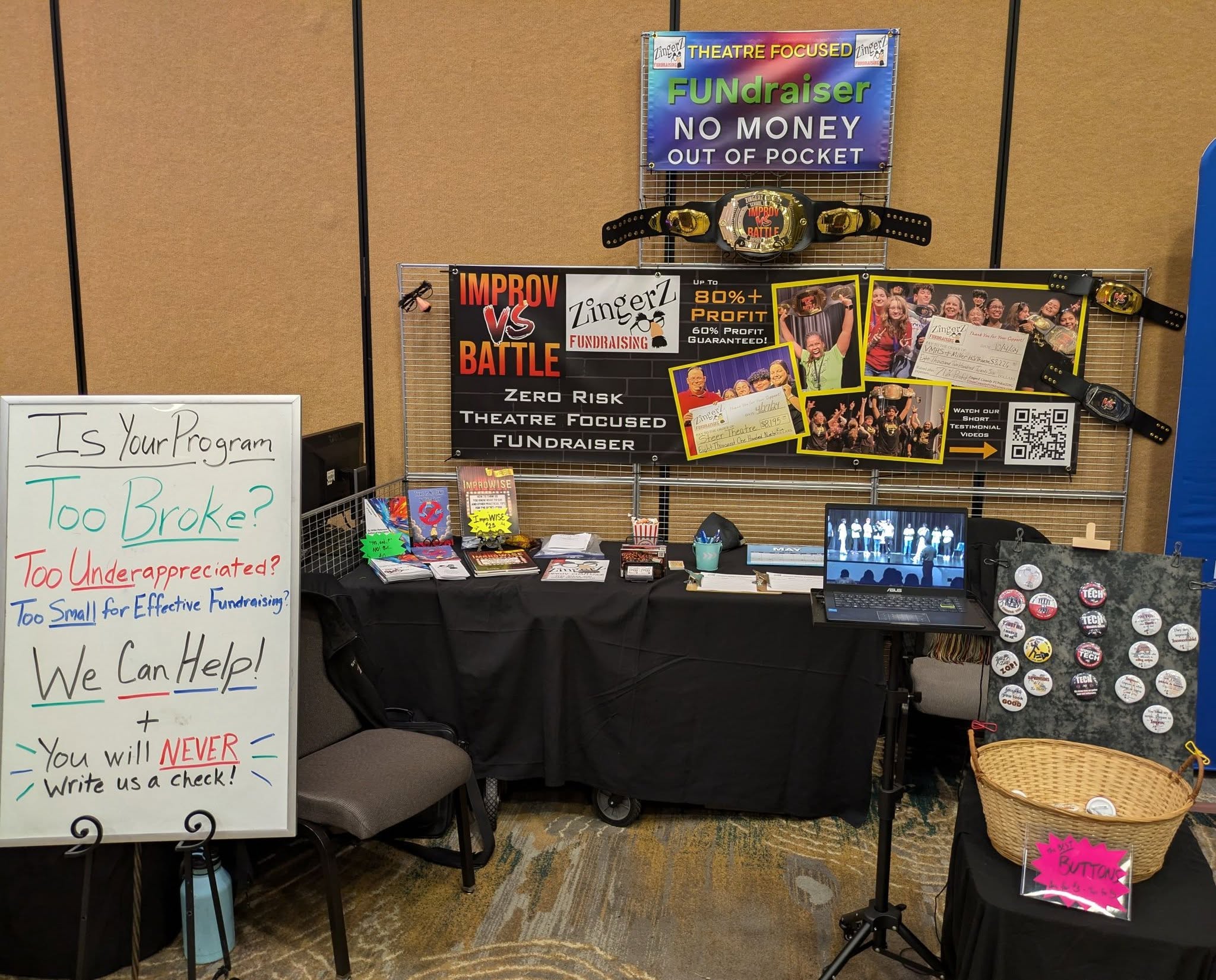 A ZingerZ Improv Battle information booth set up before the show