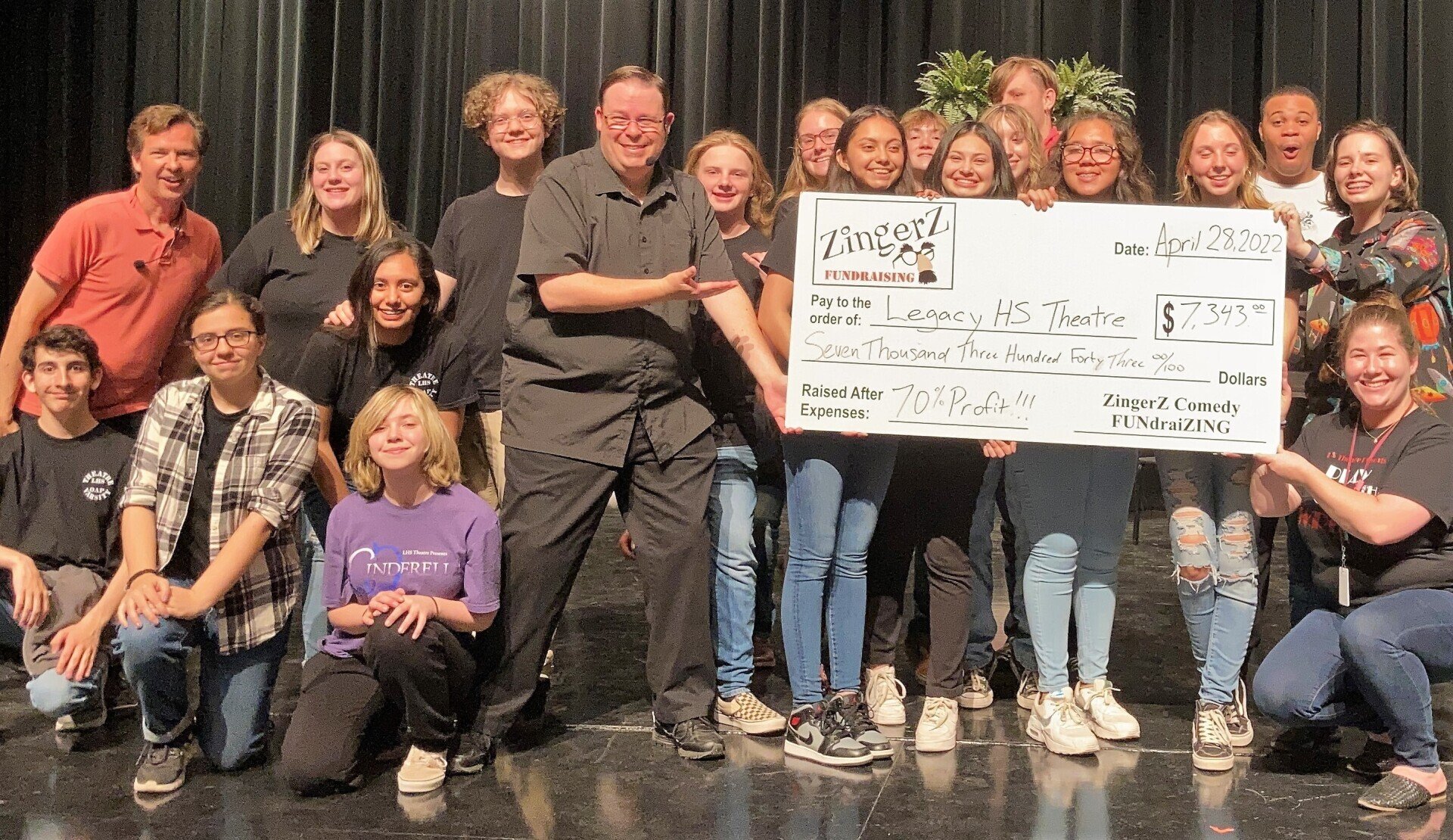 Legacy HS Theatre students holding a ZingerZ FUNdraising check