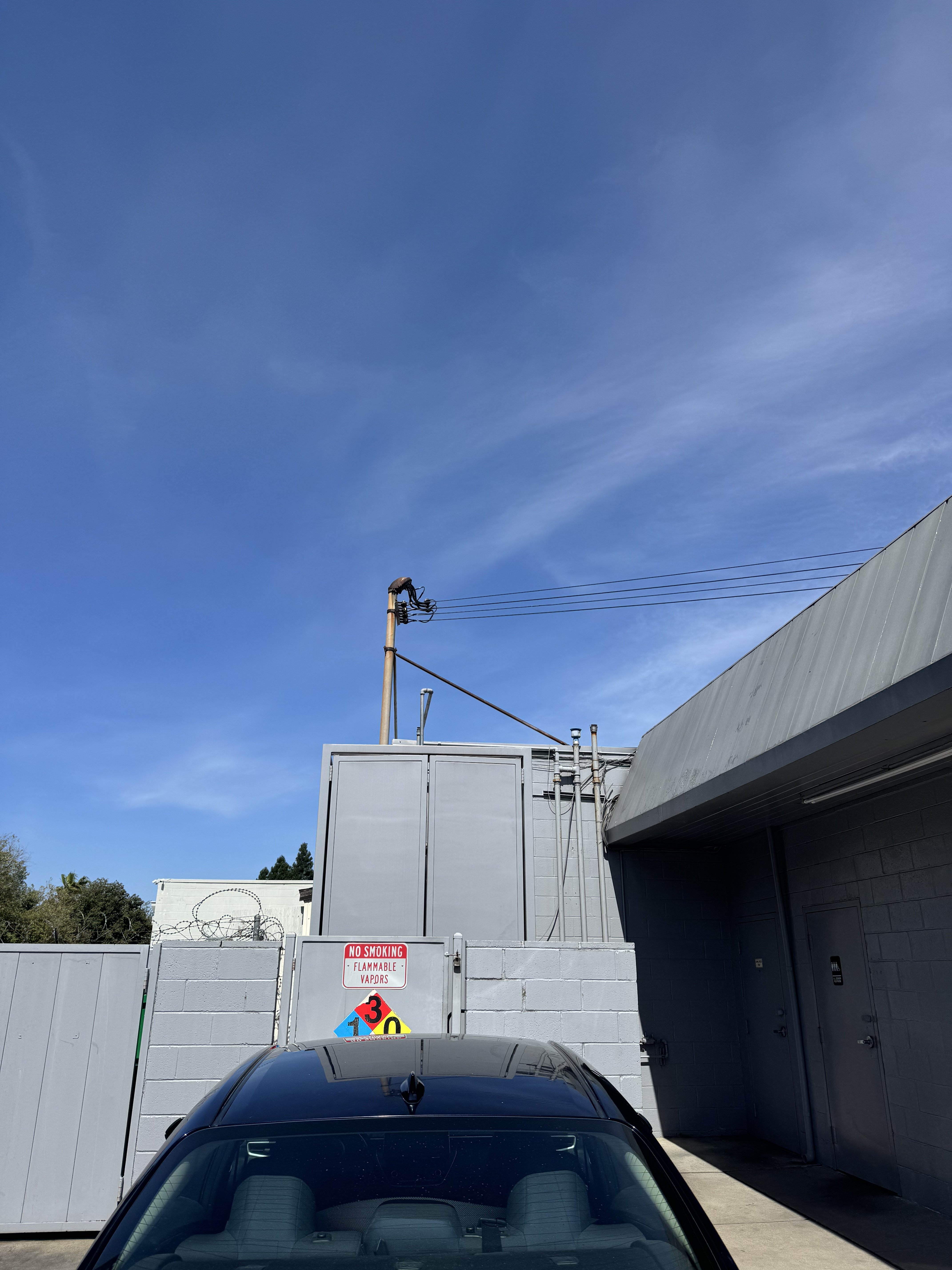 Level 2 EV charger mounted on a garage wall