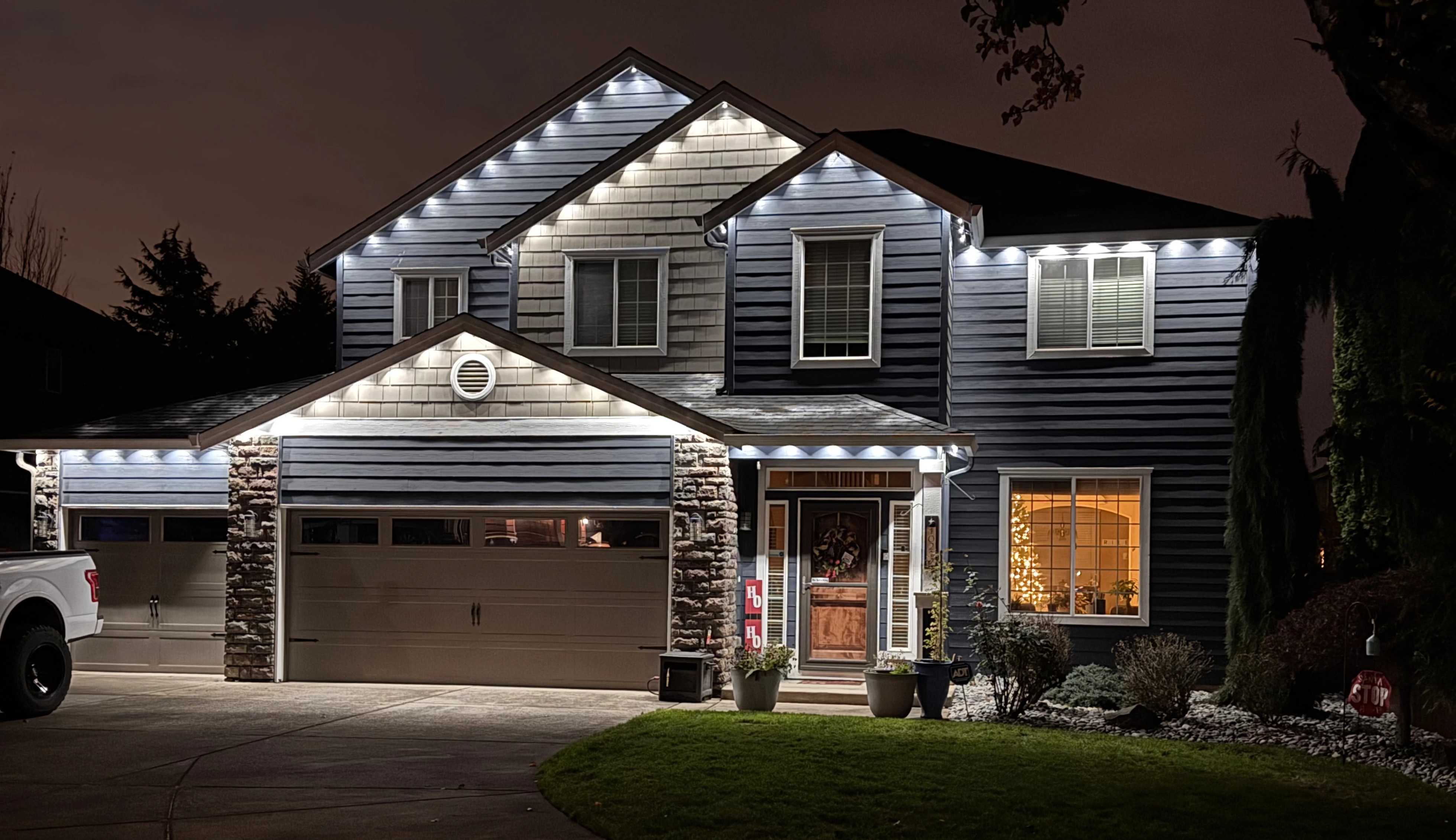 Home with permanent Govee outdoor lighting professionally installed at night in Vancouver WA
