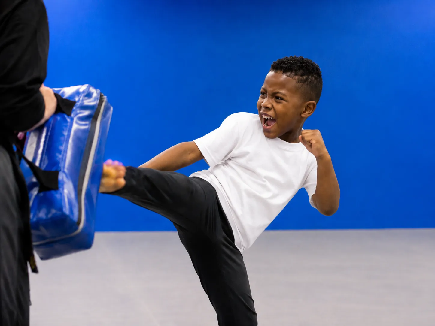 Student practicing a kick