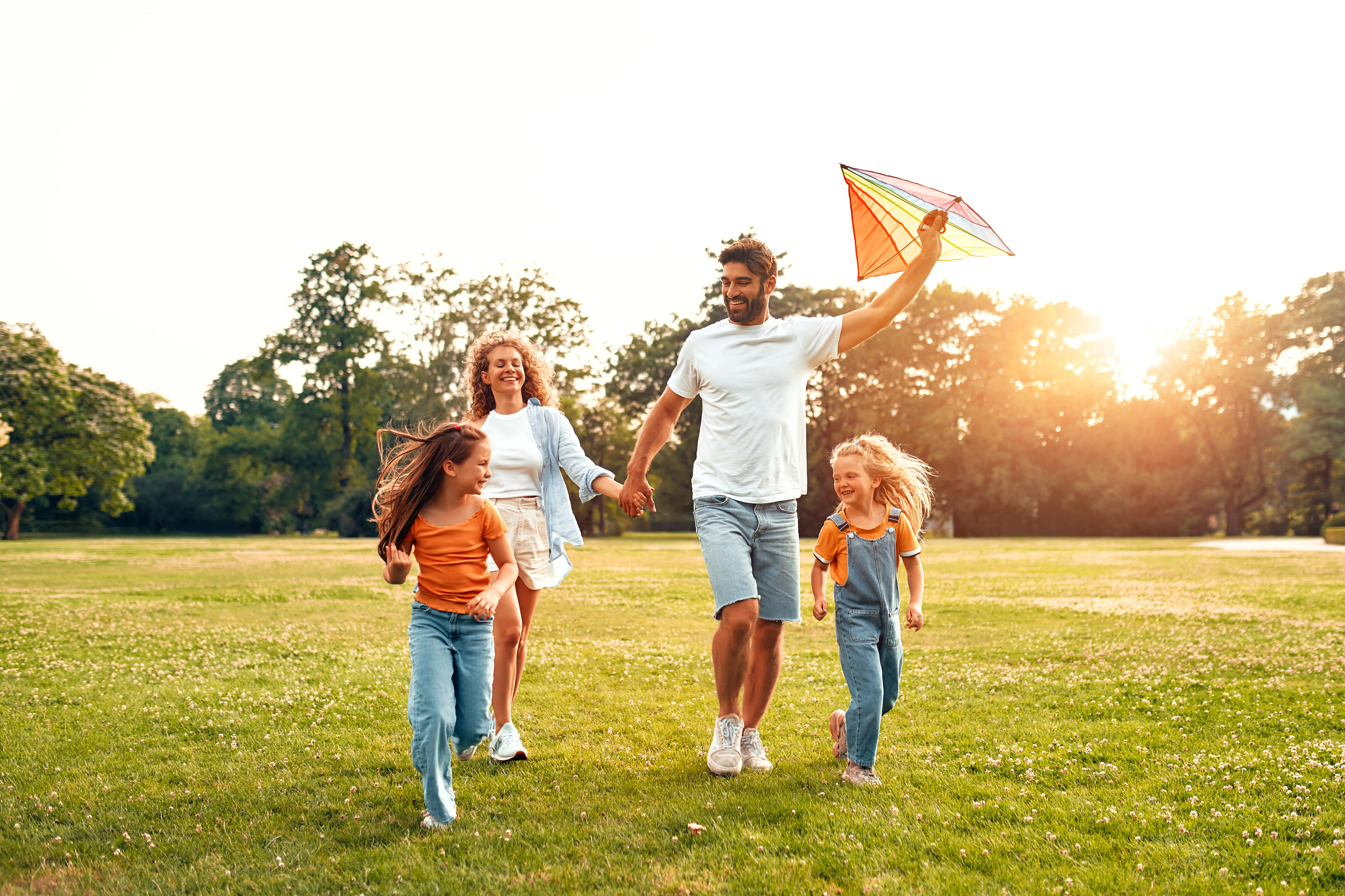 Three generations of a family standing together outdoors