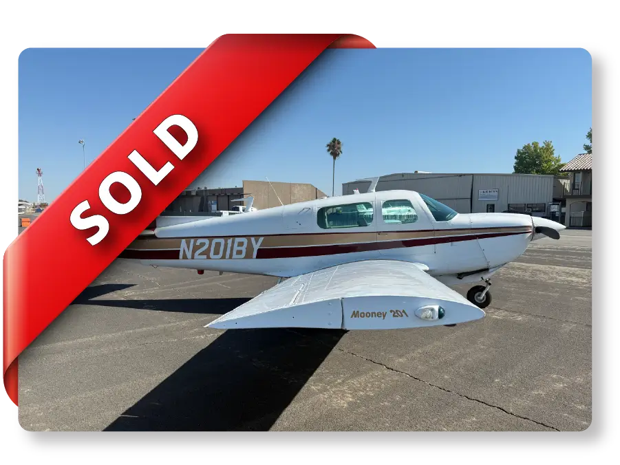 Mooney M20J with Sold Banner