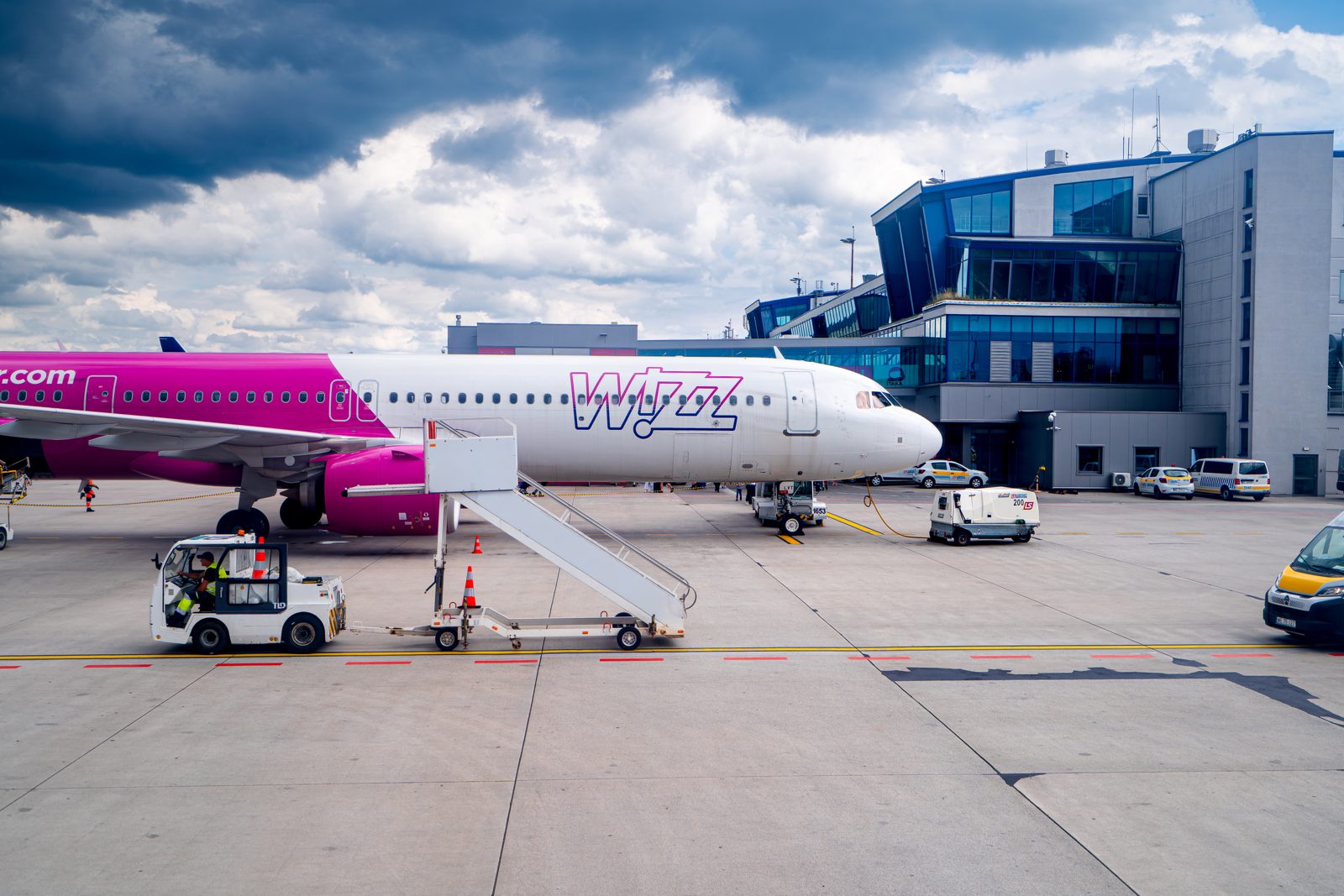 A Wizz Air aircraft parked at an airport terminal