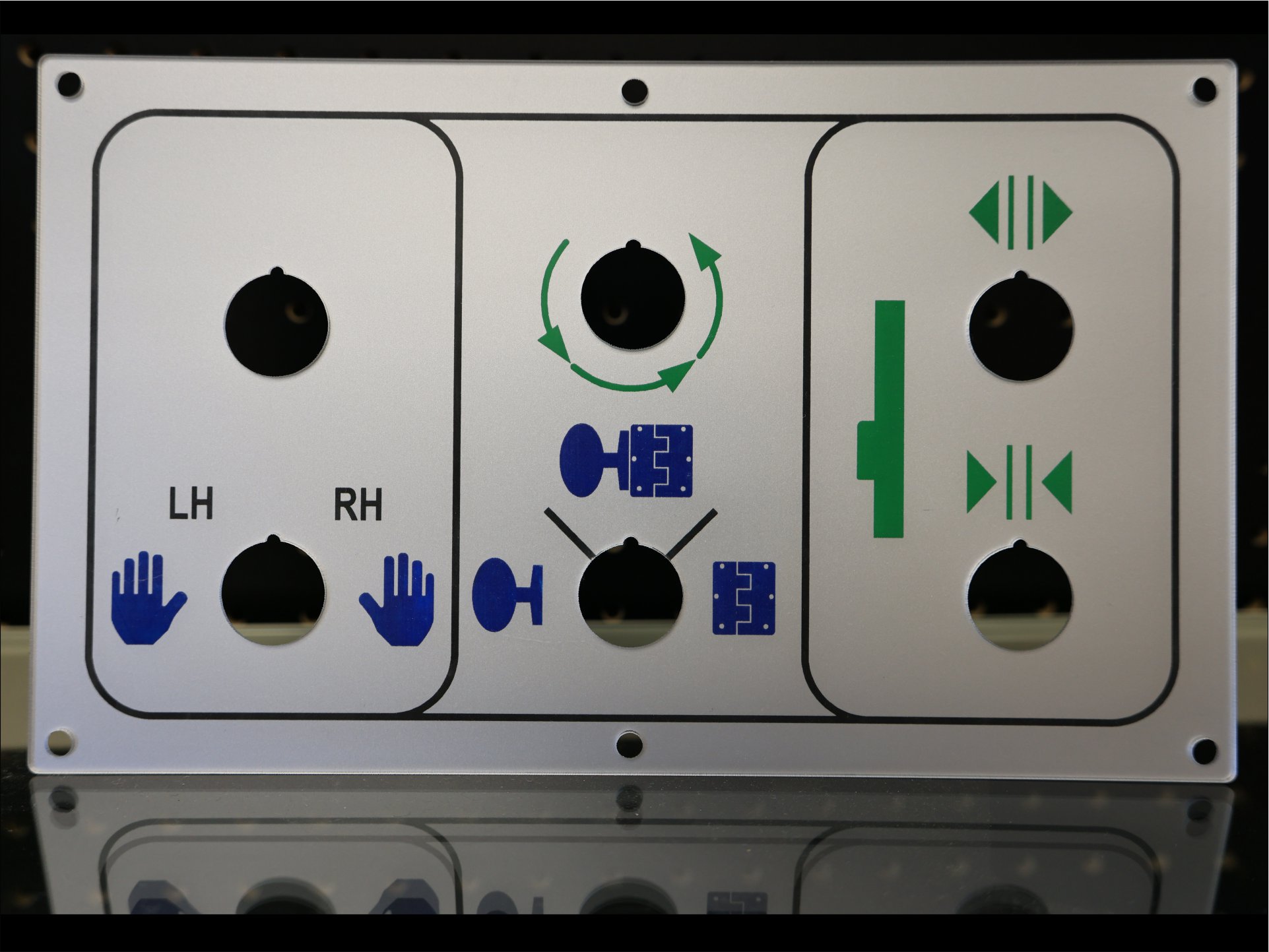 Engraved aluminium control panel legend plate with LH and RH markings, blue hand and hinge symbols and green travel arrows