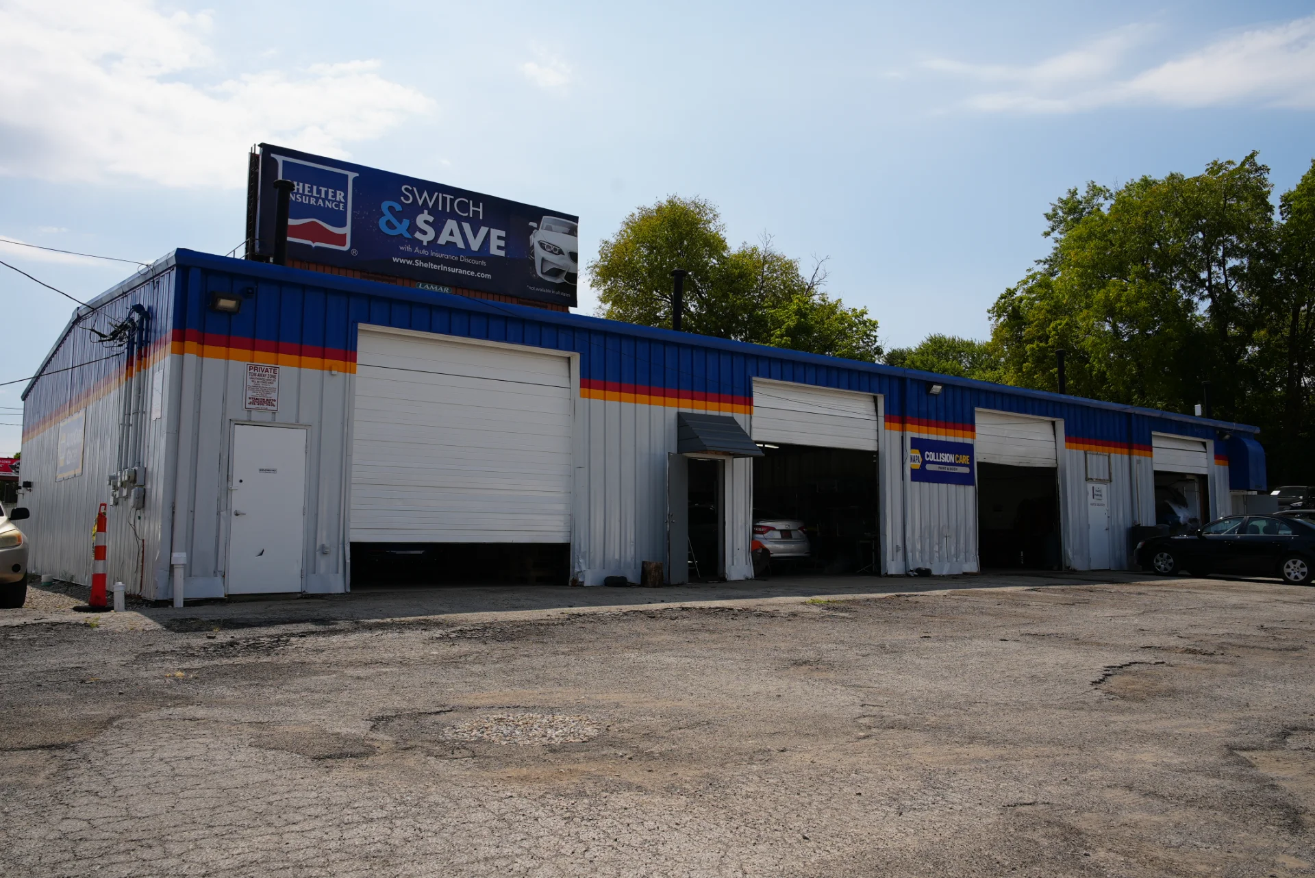 Side view of the Westerville collision shop building with its multiple repair bays