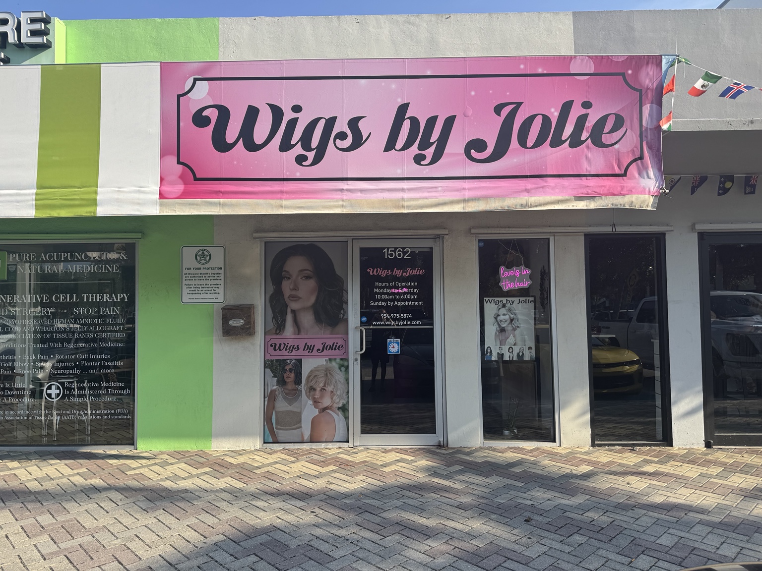Large selection of wigs displayed inside the boutique